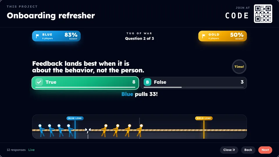 Praxis Live's Tug of War on the big screen: an onboarding refresher played as Blue against Gold